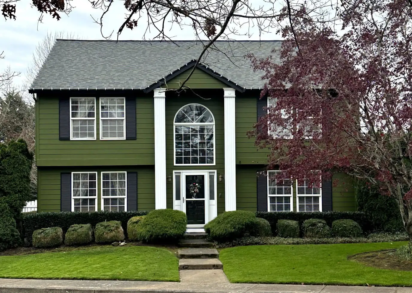 Exterior of a house in Vancouver painted in "Relentless Olive" SW 6425 by PaintitrightPro
