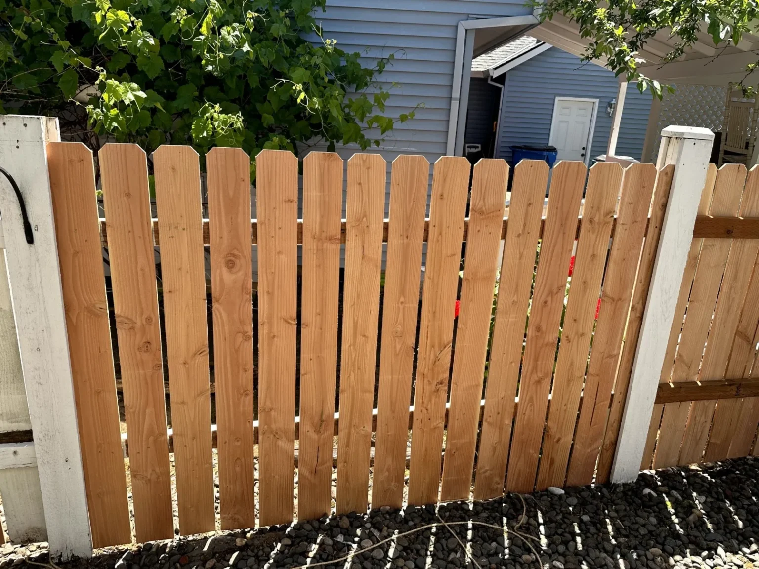 Replaced a sagging old fence with new post, cedar planks and railing by PaintitrightPro